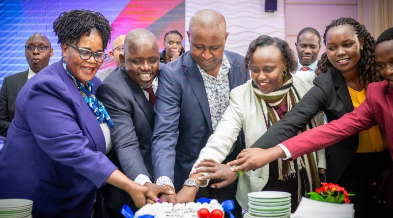 Principal Secretary State Department for Cooperatives Mr. Patrick Kilemi, CBS leads members of the SACCO IT Professionals Association (SITPA) in cake cutting to celebrate the association's official launch. PHOTO/COURTESY