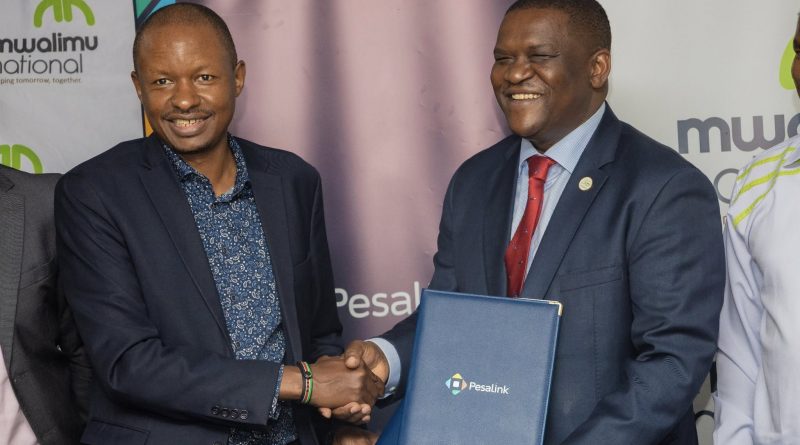 Mwalimu National DT SACCO CEO Kenneth Odhiambo with Pesalink CEO Gituku Kirika during the partnership signing. PHOTO/COURTESY