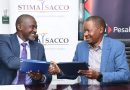 Stima SACCO CEO Dr. Gamaliel Hassan with Pesalink CEO Gituku Kirika during the signing ceremony. PHOTO/COURTESY