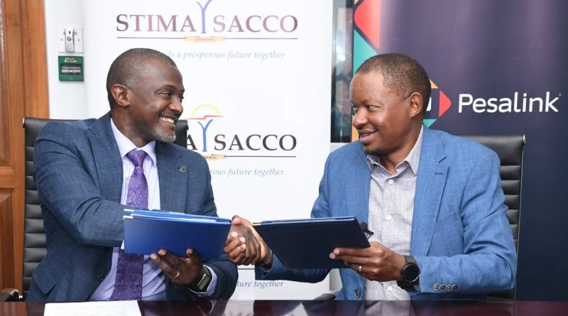 Stima SACCO CEO Dr. Gamaliel Hassan with Pesalink CEO Gituku Kirika during the signing ceremony. PHOTO/COURTESY